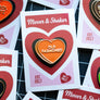 A heart-shaped enamel pin reading 'OLD FASHIONED' in white lettering, with an orange center, red and black border, and a white backing card that says 'Mover & Shaker' and 'EST. 2017'.
